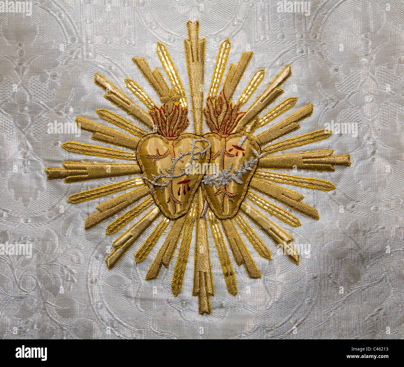 detail from vestment - heart of Mary and Jesus Stock Photo