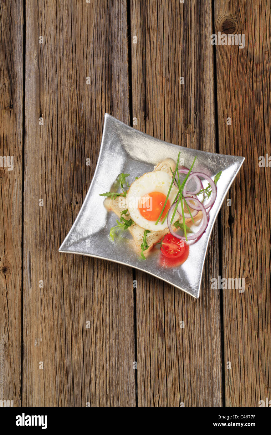 Sunny side fried egg bread slice breakfast cooked hires stock