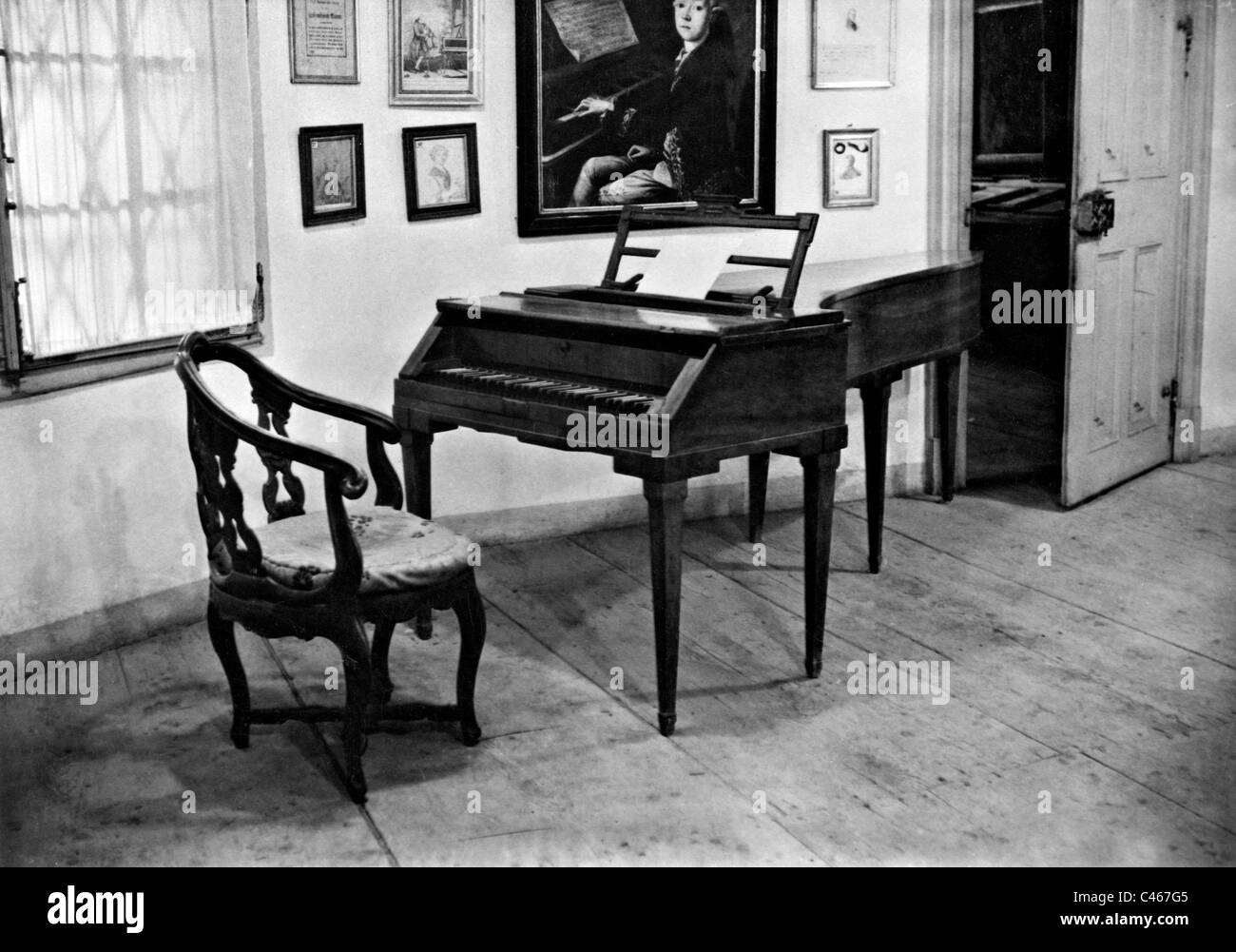 Mozart's birth room with piano, 1931 Stock Photo