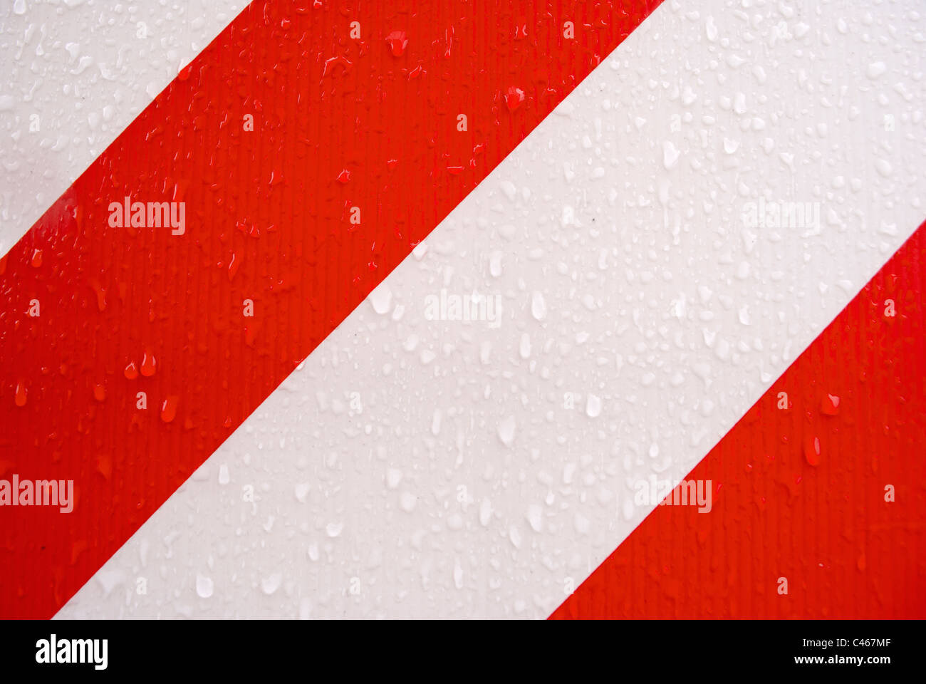 red and white stripes, with drops of water Stock Photo