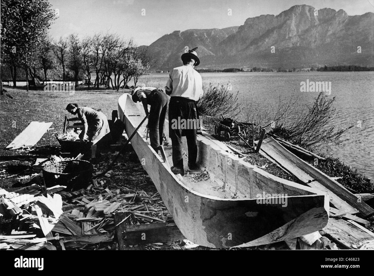 Fishermen build a dugout, 1939 Stock Photo