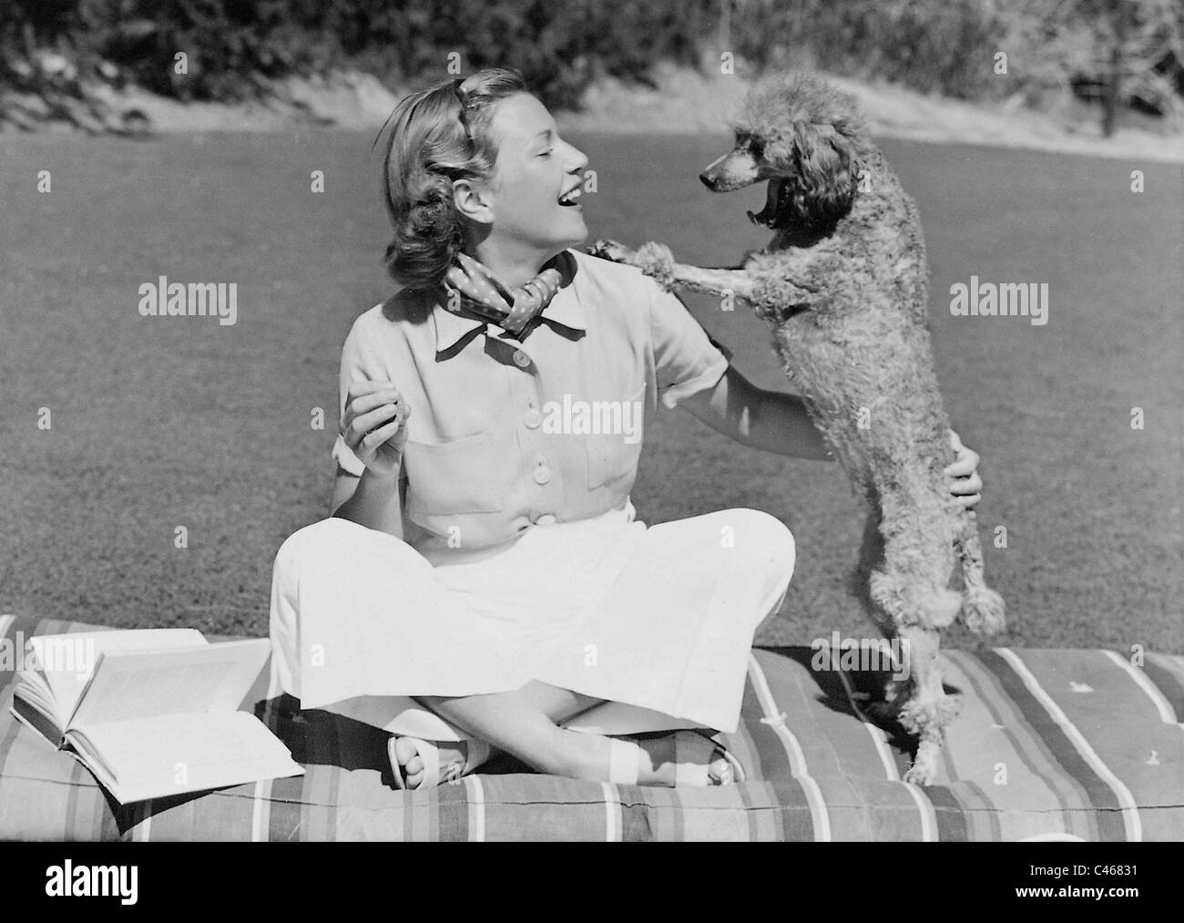 Annabella with poodle, 1938 Stock Photo