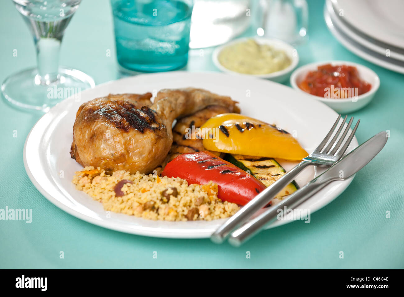 Chicken with rice and seared peppers. Stock Photo