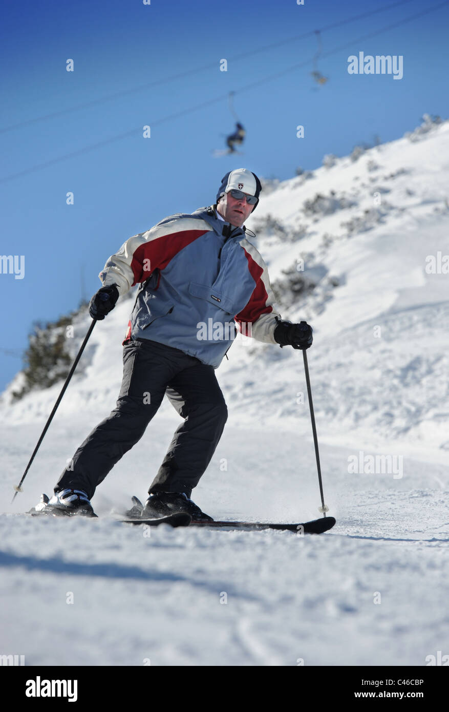 An intermediate skier at the Vogel Ski Centre in the Triglav National Park of Slovenia Stock