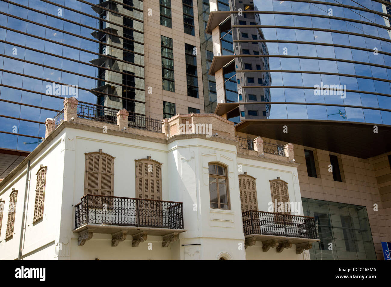 Photograph of an old building near a new one in the city of Tel Aviv Stock Photo