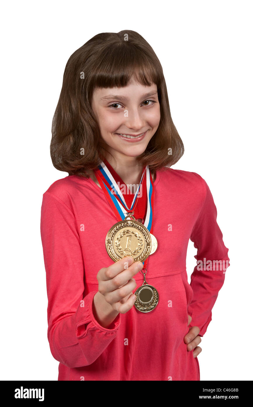 Girl shows gold medal winner isolated on a white background Stock Photo