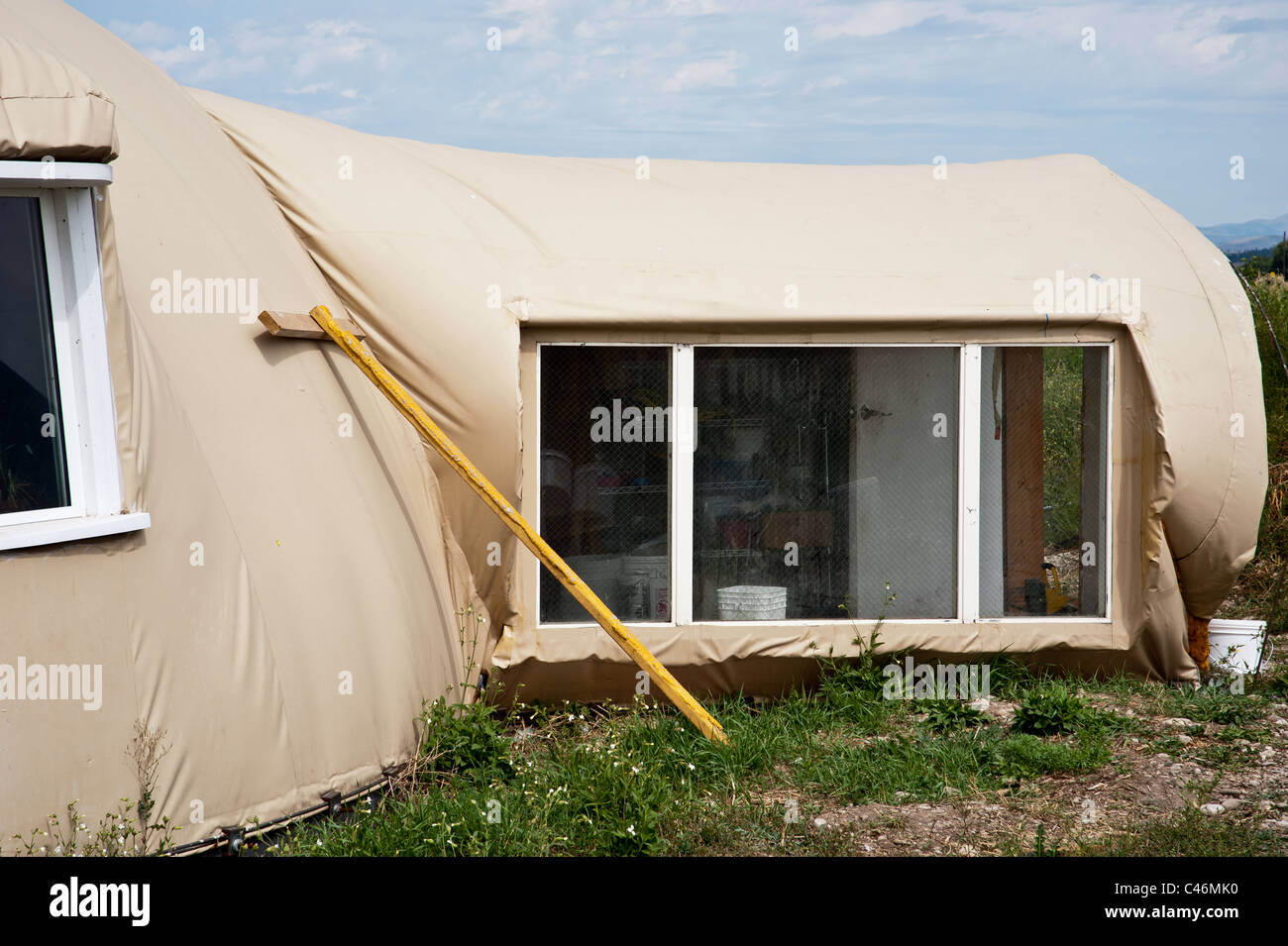 This energy efficient "monolithic dome" house is made using a vinyl dome and layers of foam