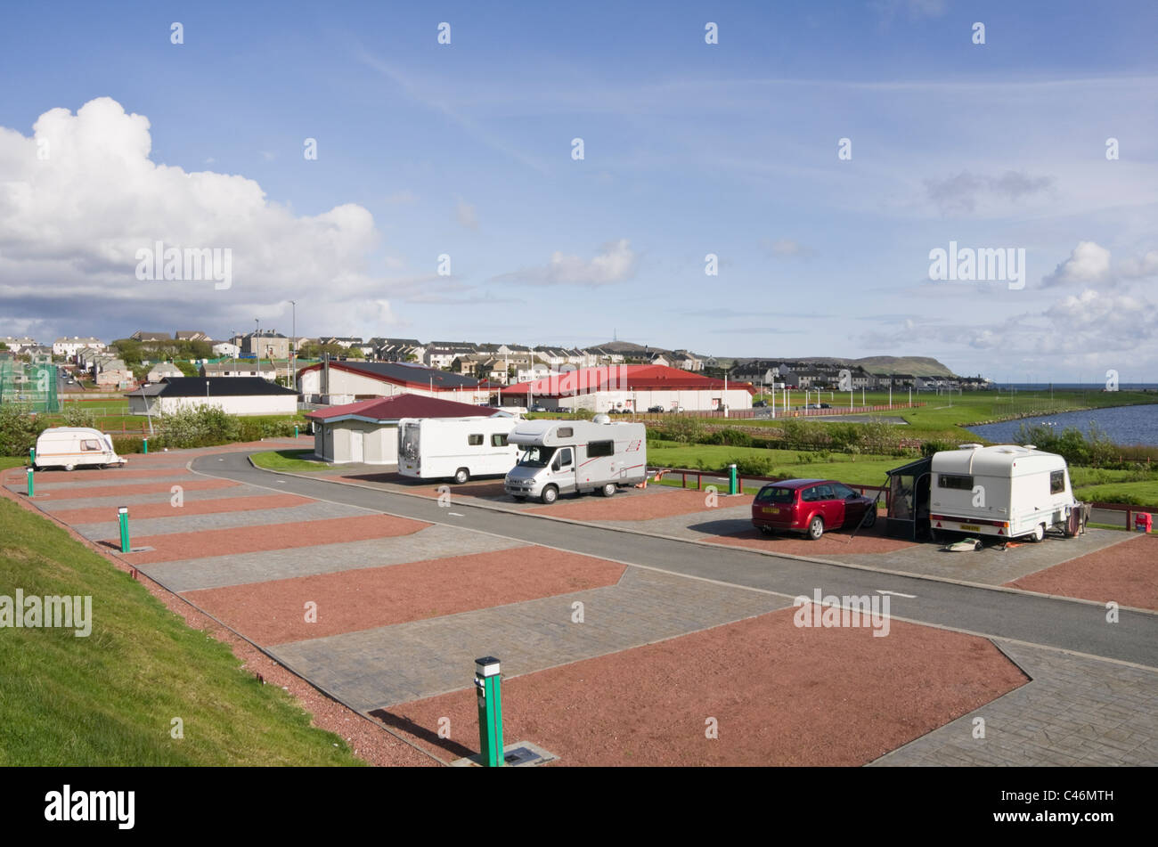 Clickimin Leisure Complex campsite with sports centre beyond. Lerwick, Shetland Islands, Scotland, UK, Britain. Stock Photo