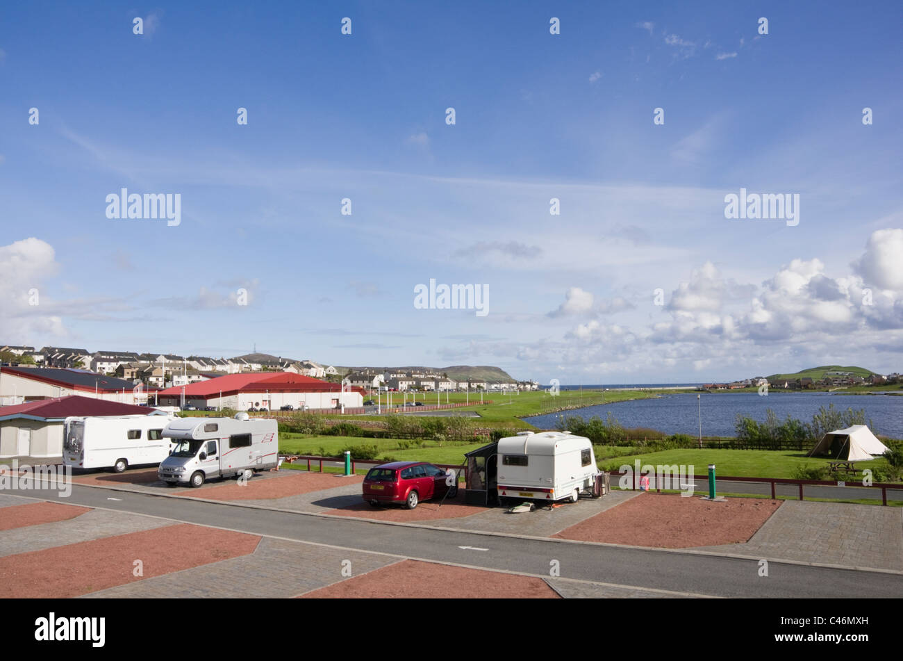 Clickimin Leisure Complex campsite and Loch with sports centre beyond. Lerwick, Shetland Islands, Scotland, UK, Britain. Stock Photo
