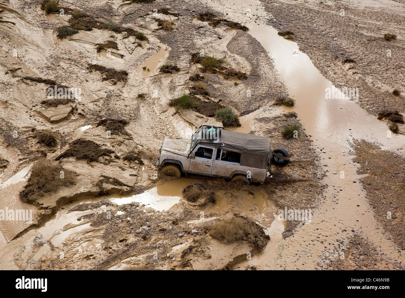 Aerial photograph of a Jeep stuck in the mud of a flooded wadi in the Arava Stock Photo