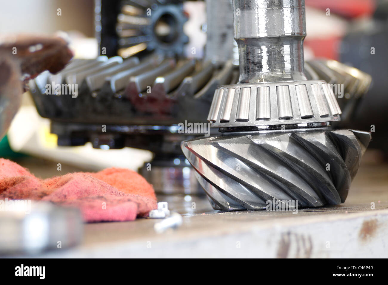 Automobile hypoid bevel gear input pinion, with tapered roller bearing cage on shaft Stock Photo