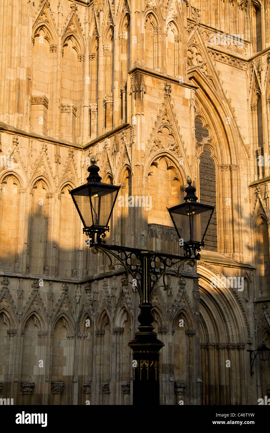 Old lamplight before the intricate architecture of york minster Stock