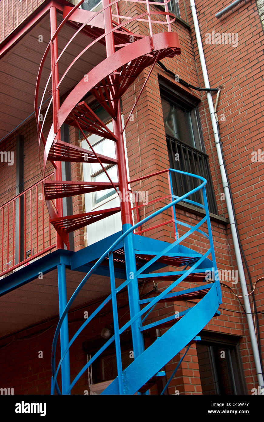 Spiral staircase brick condominium apartments Montreal Quebec Stock Photo