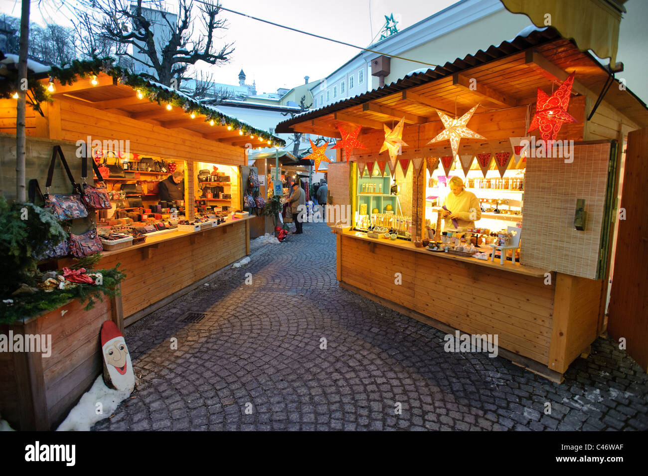 christmas market with shops in medieval old town of city Salzburg in Austria Stock Photo