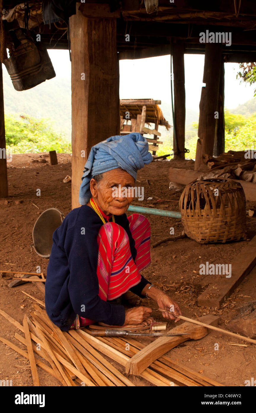 Old Woman weaving basket in a Karen Village Stock Photo