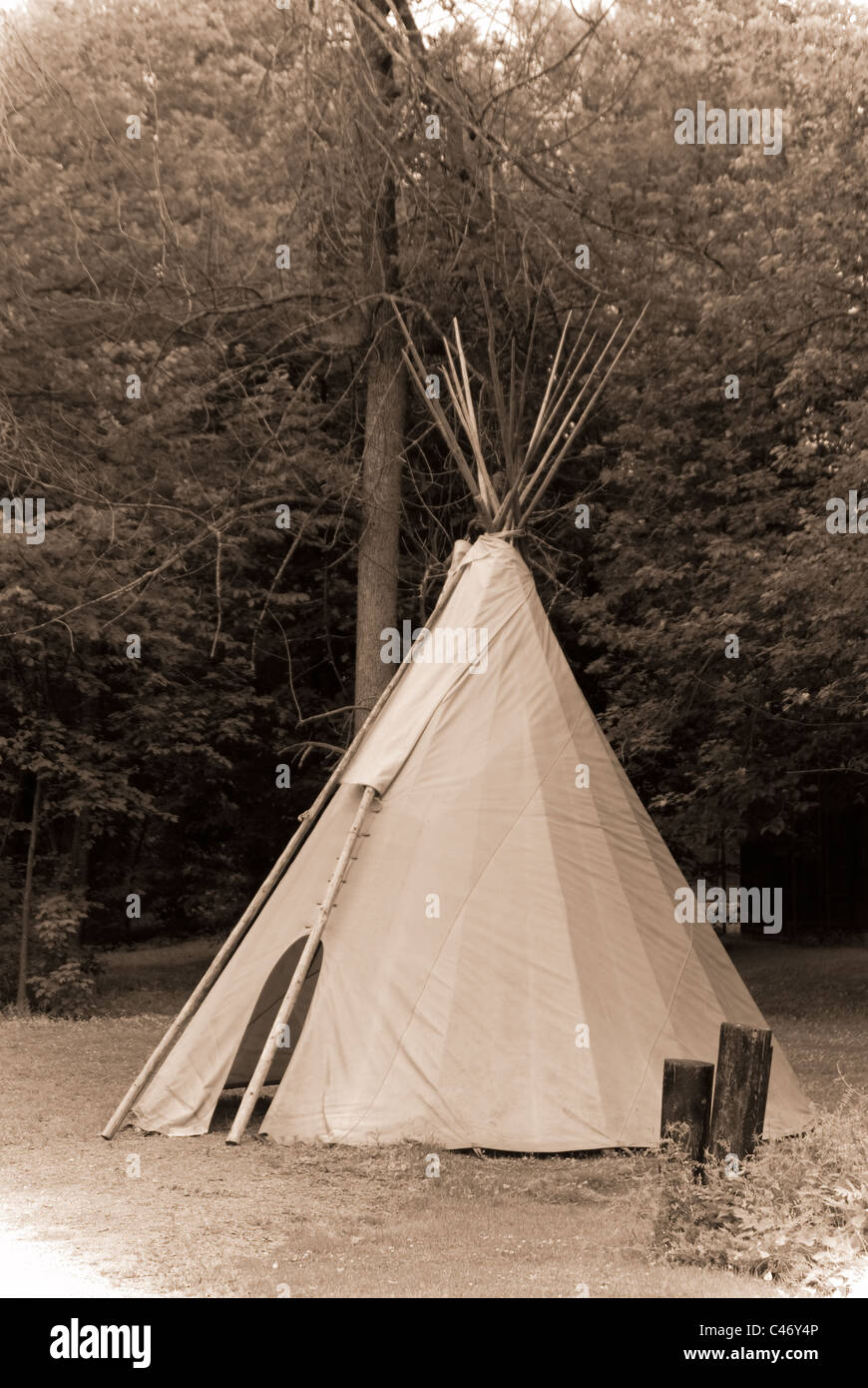 A traditional Indian tipi photographed in a faux antique, faded sepia style simulating an early 20th century photograph. Stock Photo