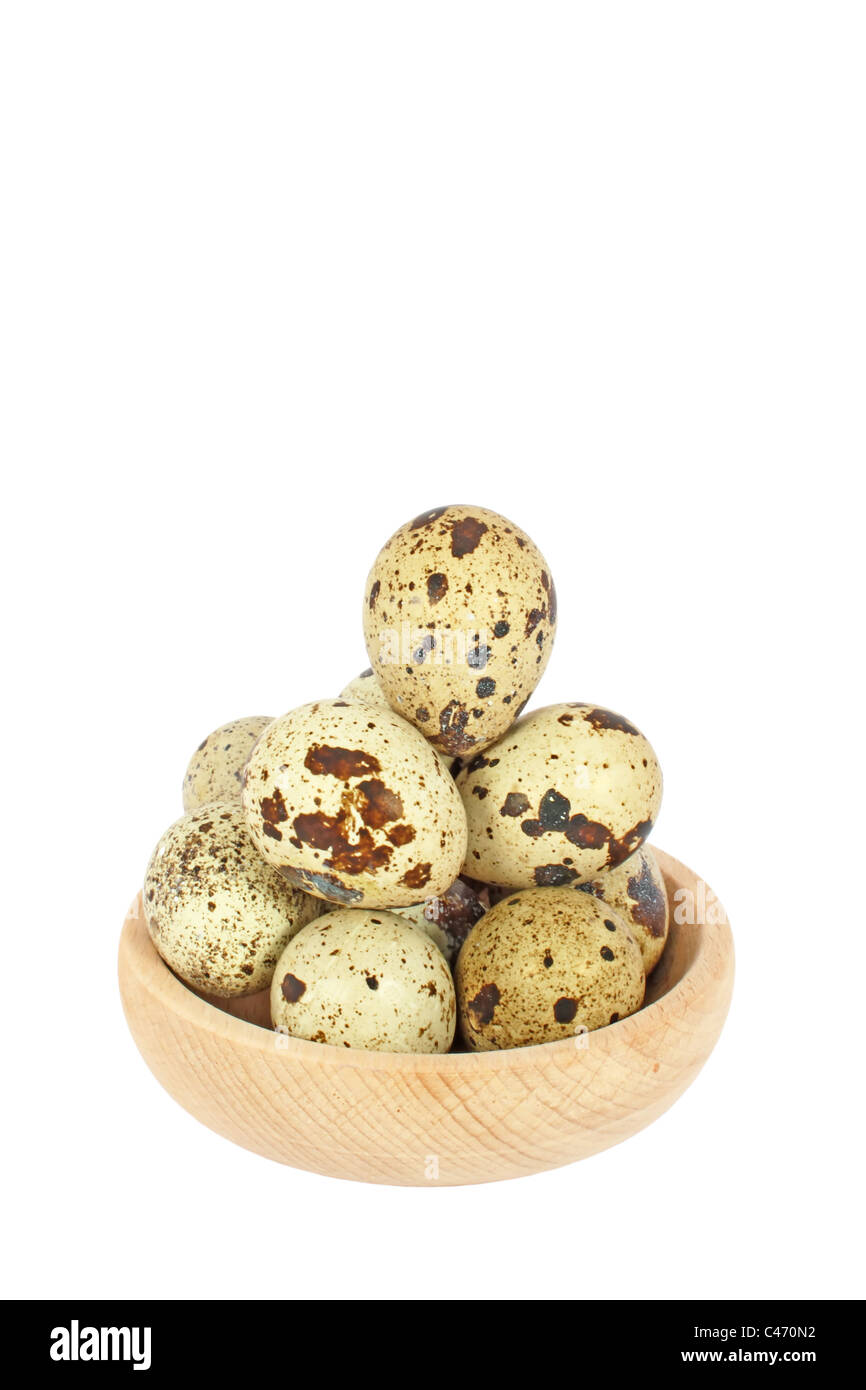 Eggs of Japanese quail in wooden bowl isolated on white Stock Photo Alamy