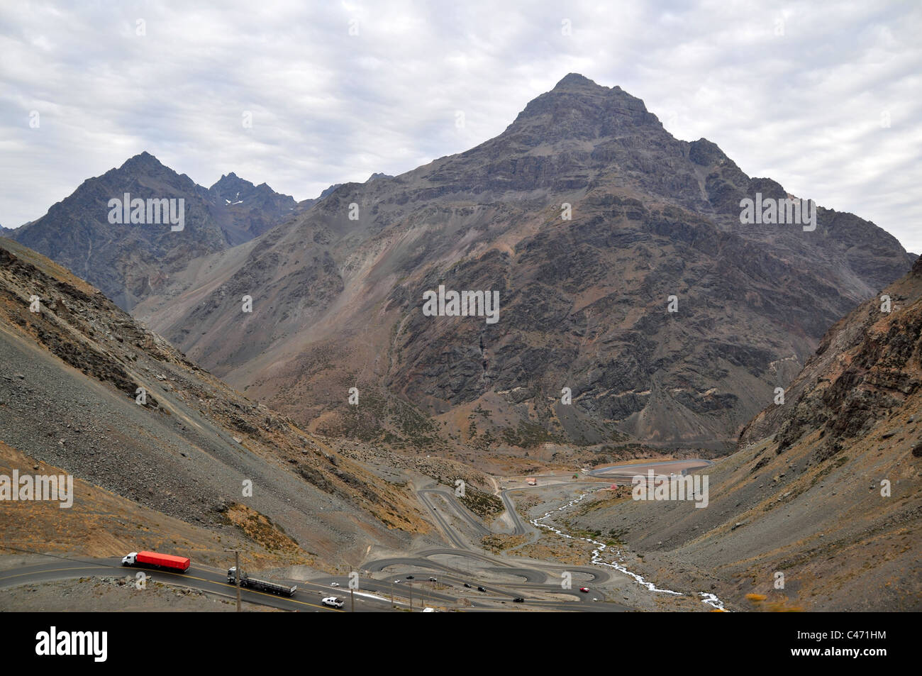 Two lorries at the top of hairpin bends descending into the Aconcagua River Valley, Ruta 7, summit Uspallata Pass, Andes, Chile Stock Photo