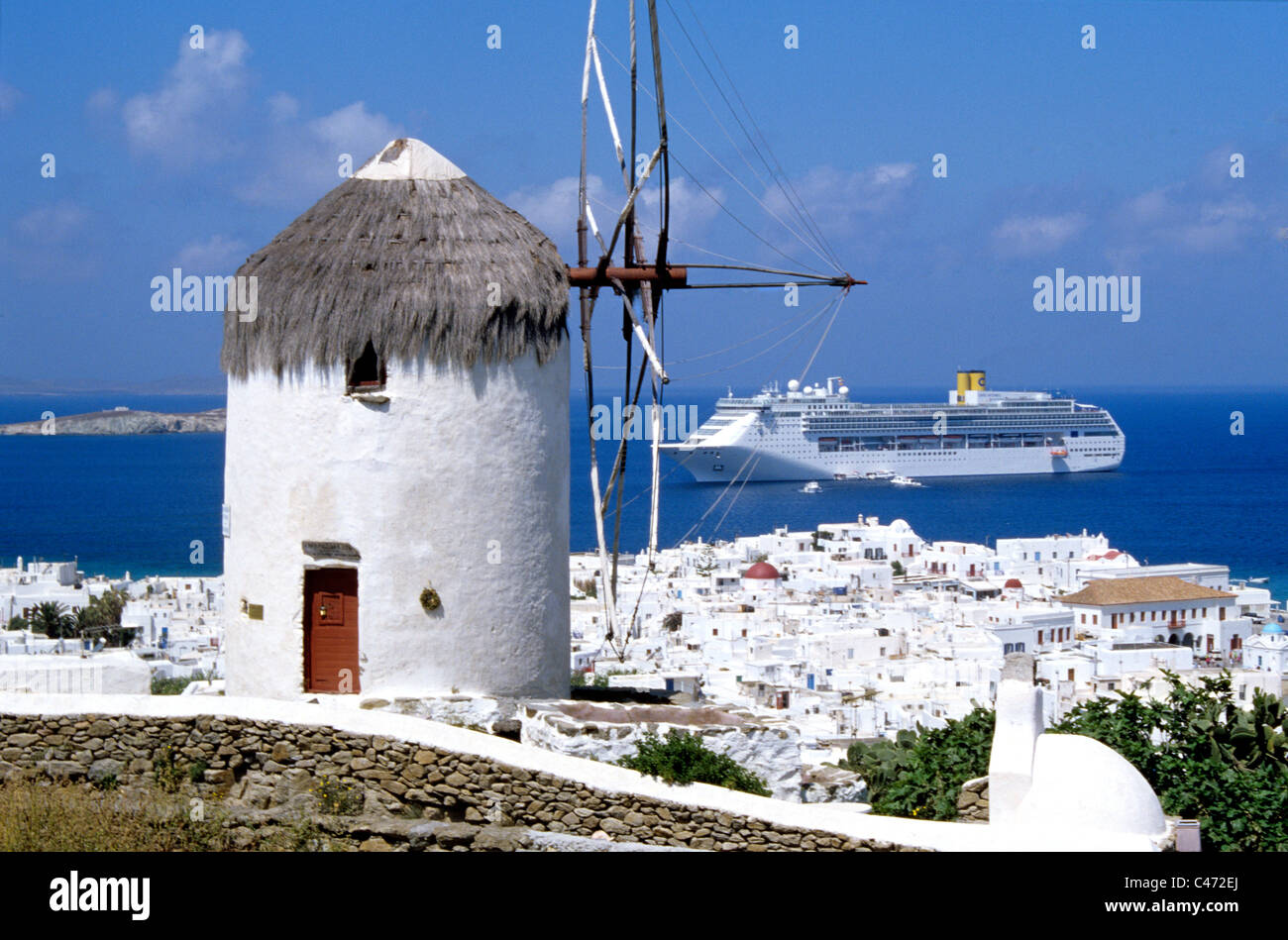 Costa cruise ship visits port of Mykonos Greece in the Cyclades in the Agean sea. Stock Photo
