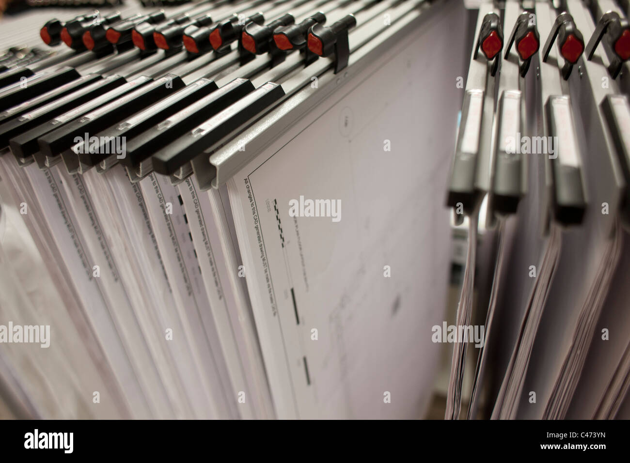 architectural plans hanging in a rack Stock Photo - Alamy