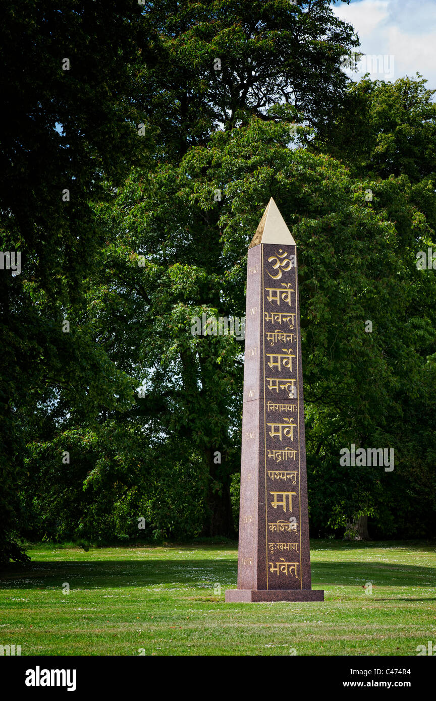 Om and Sanskrit on the peace Obelisk at Waterperry gardens, Wheatley, Oxfordshire. UK Stock Photo