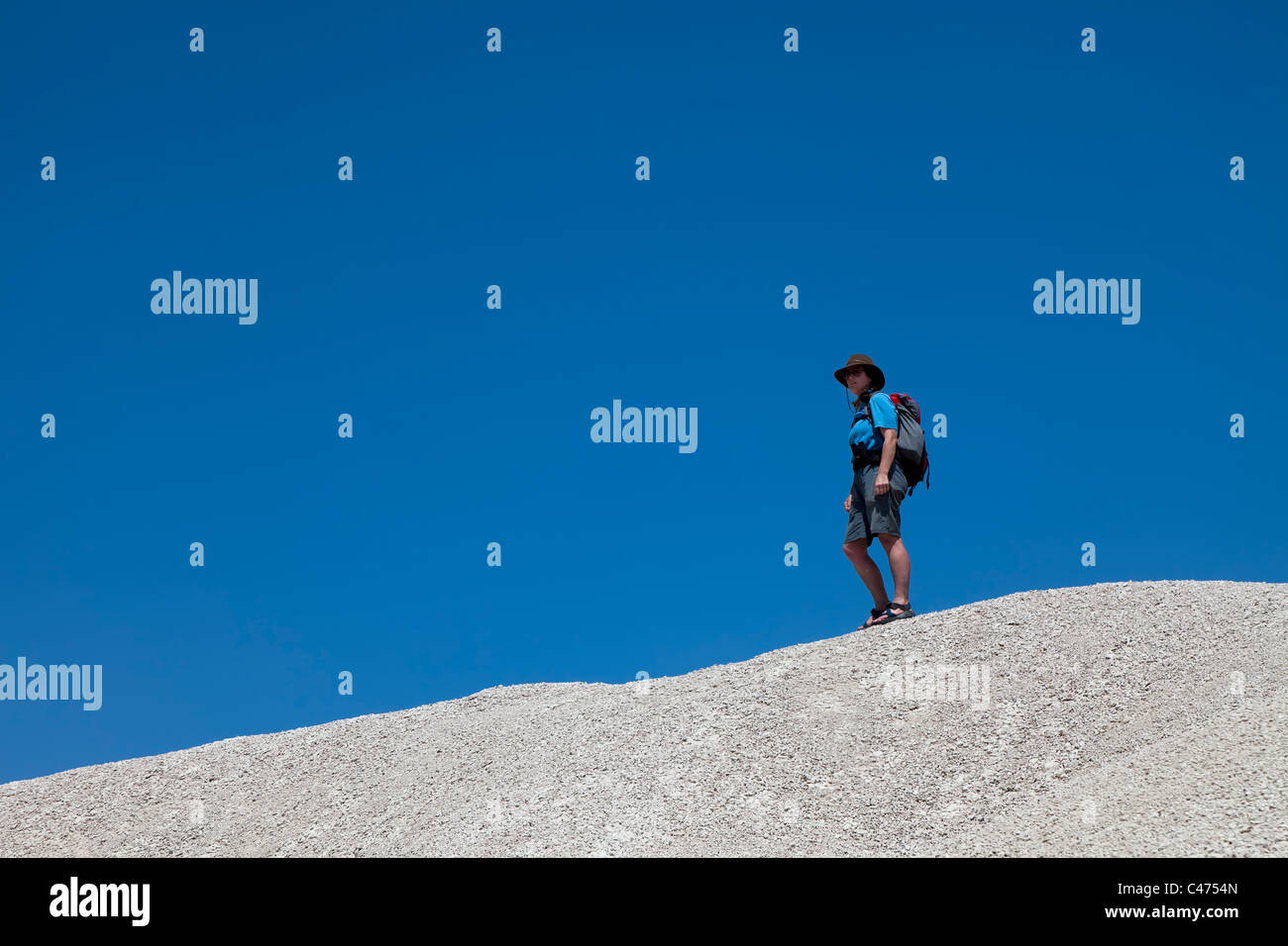 Woman backpacking on skyline in desert Big Bend National Park Texas USA Stock Photo