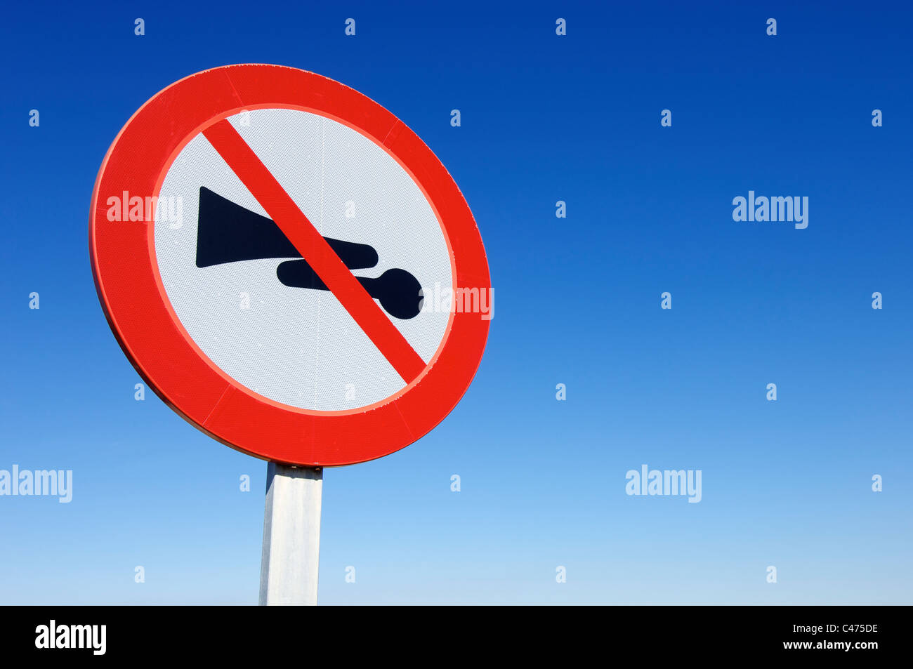 traffic sign indicating the prohibition of using the vehicle horn Stock