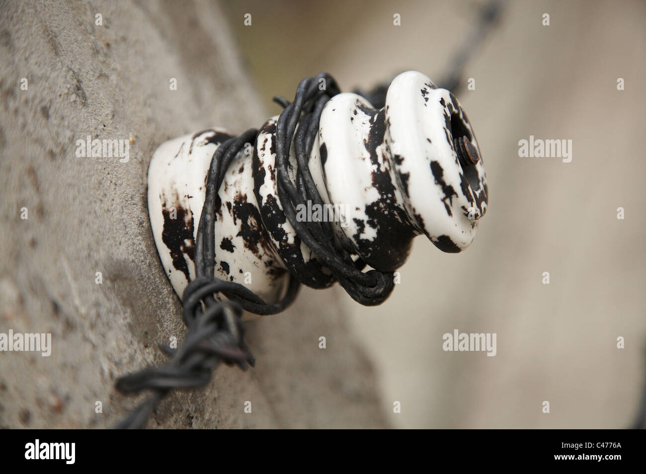 Electrified barbed wire around a concentration prison camp of Auschwitz-Birkenau Stock Photo