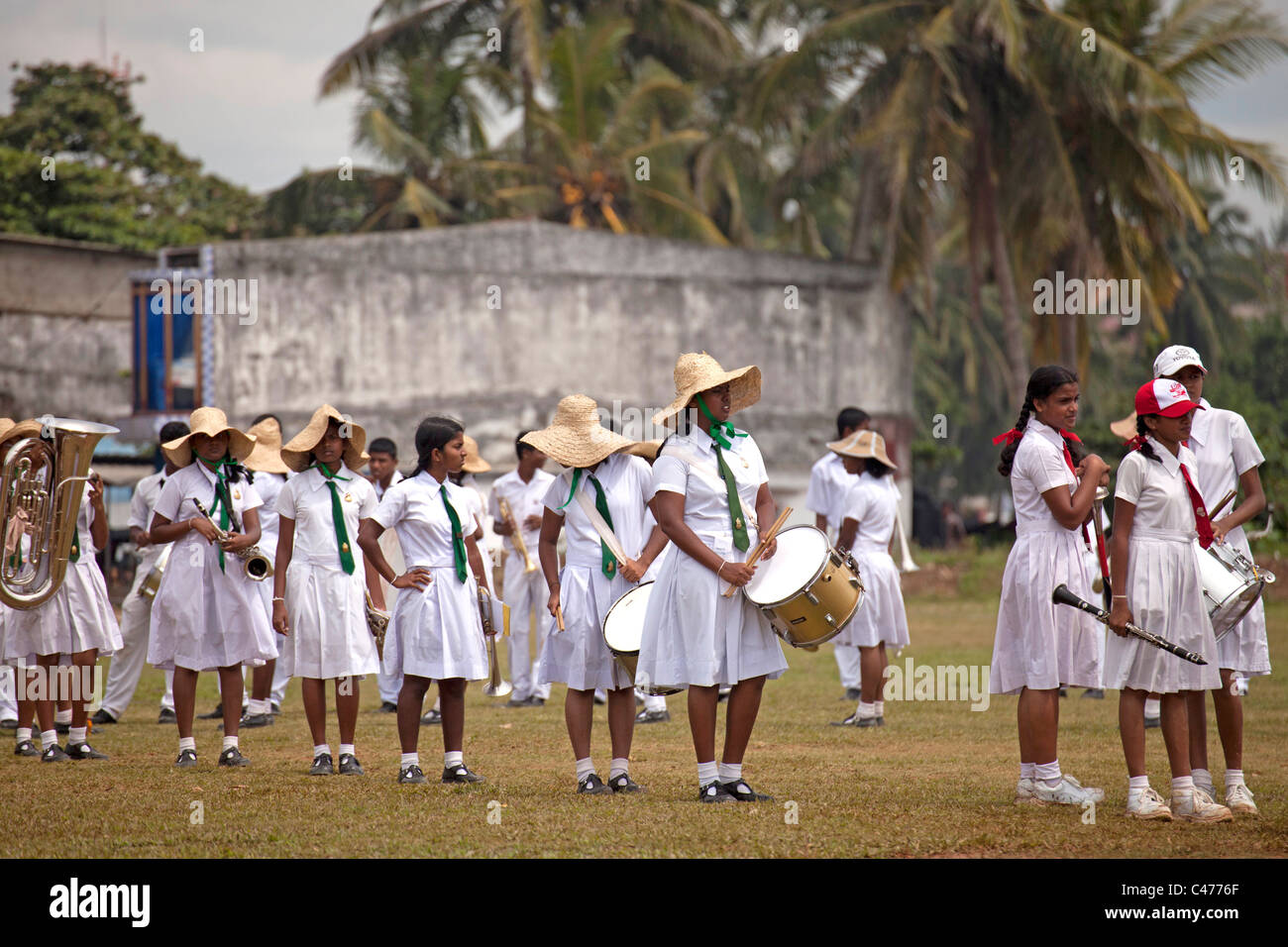 school girls in uniform, members of a marching band during a parade in Galle, Sri Lanka Stock Photo