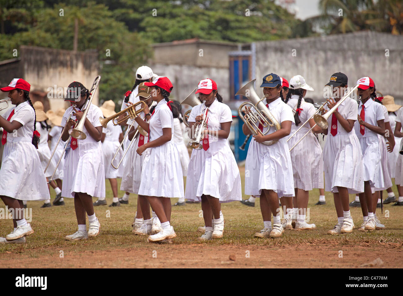 school girls in uniform, members of a marching band during a parade in Galle, Sri Lanka Stock