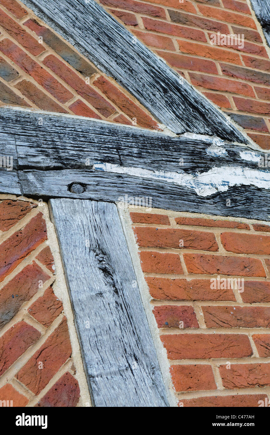 Traditional English oak wood timber framed brick construction, with wooden pins Stock Photo