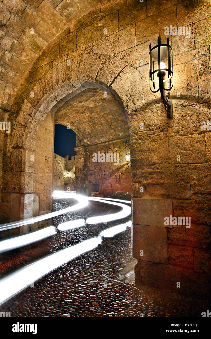 A car crossing the Gate d' Amboise of of the main gates of the Medieval town of Rhodes, Greece Stock Photo