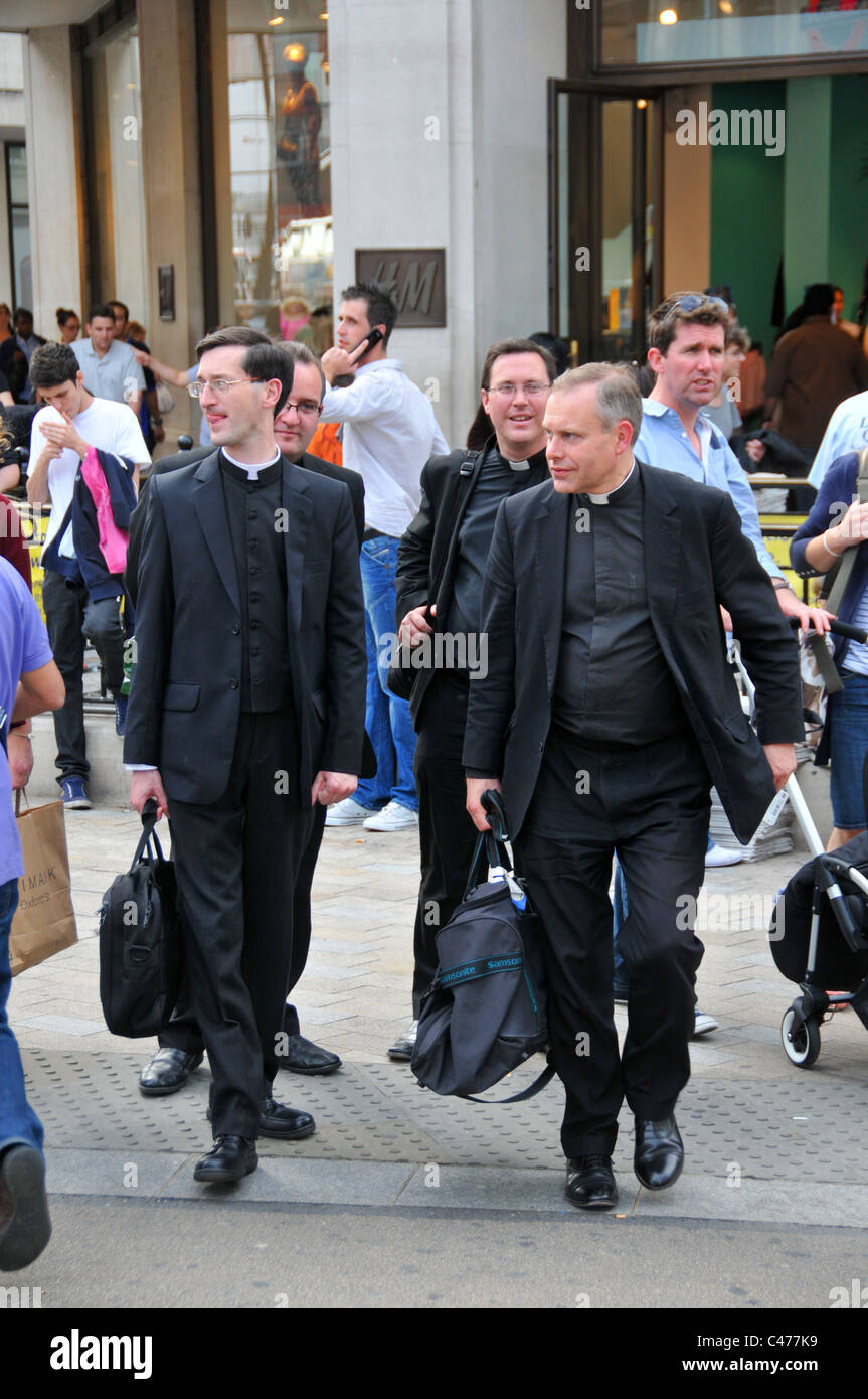 Church of England Four vicars vicar priests Reservoir Dogs lets go to work Rat pack men in black Stock Photo