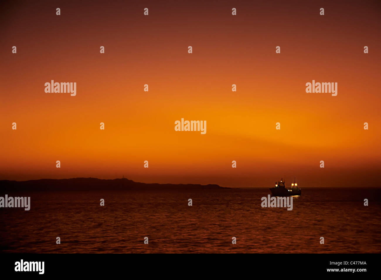 Fishing boat in sunset sea hi-res stock photography and images - Alamy