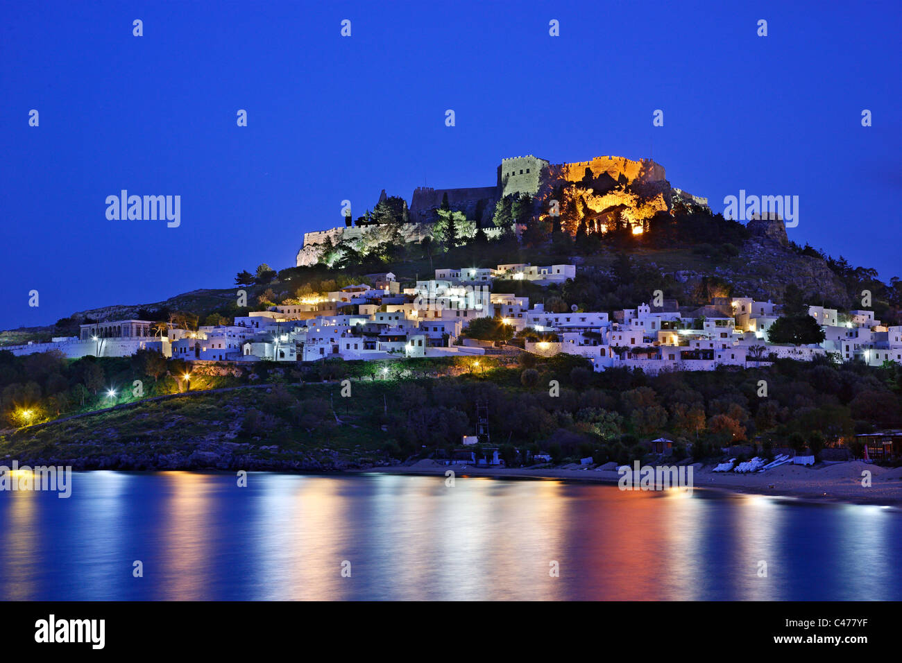 Beautiful Lindos village with its castle (Acropolis) in the 'blue' hour. Rhodes island, Dodecanese, Greece Stock Photo