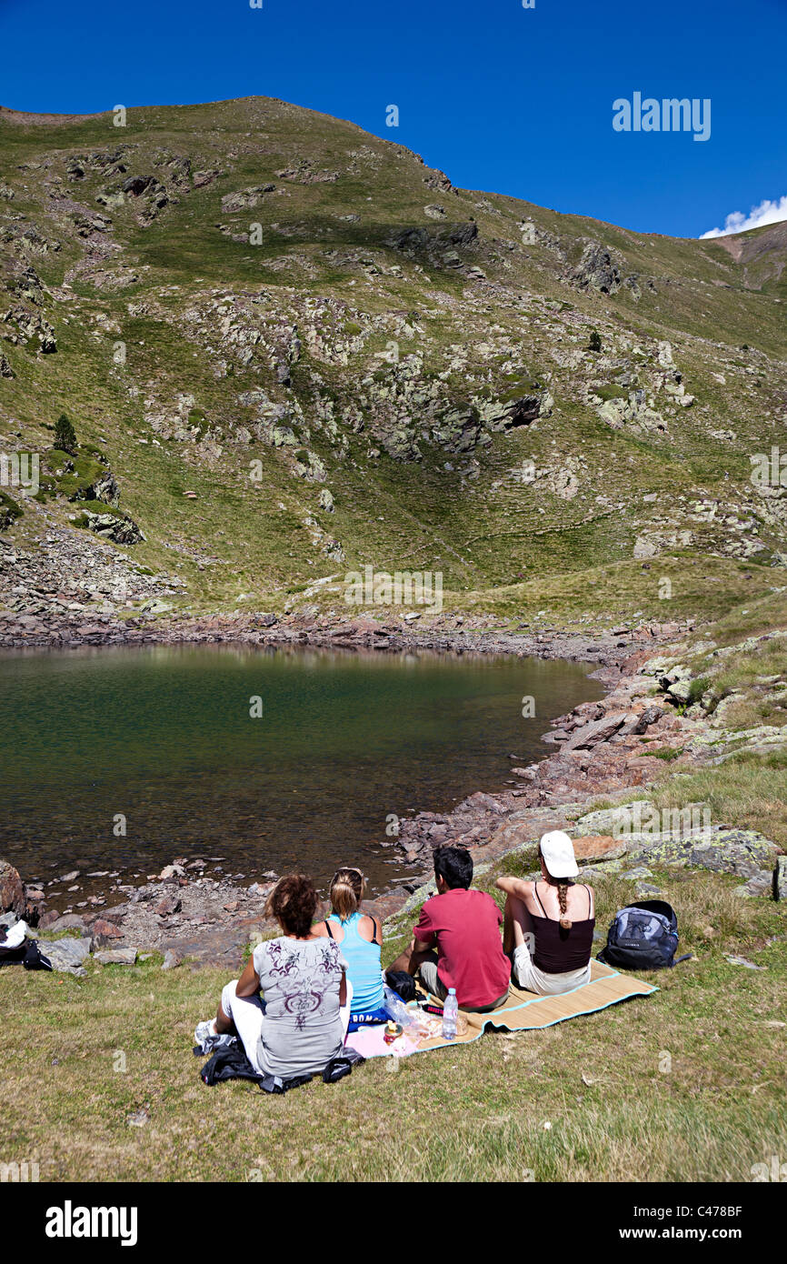 Picnic beside lake Asses de les Salamandres Vall d'Incles Andorra Stock Photo
