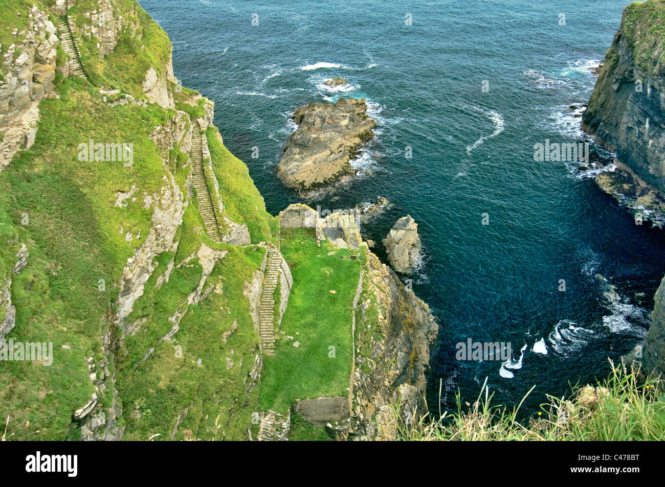 The 330 Whaligoe Steps descend a cliff to North Sea coast Whaligoe Harbour, Wick, Caithness, Scotland. 19th C herring fish boom Stock Photo