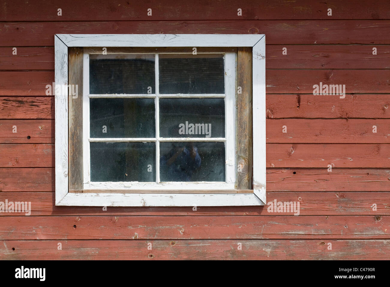red wood wall and window Stock Photo - Alamy