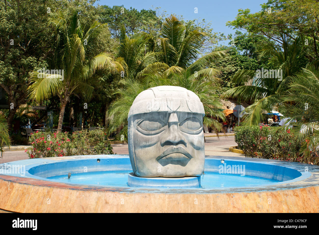 Olmec stone head and fountain in Playa del Carmen, Riviera Maya, Quintana Roo, Mexico Stock Photo