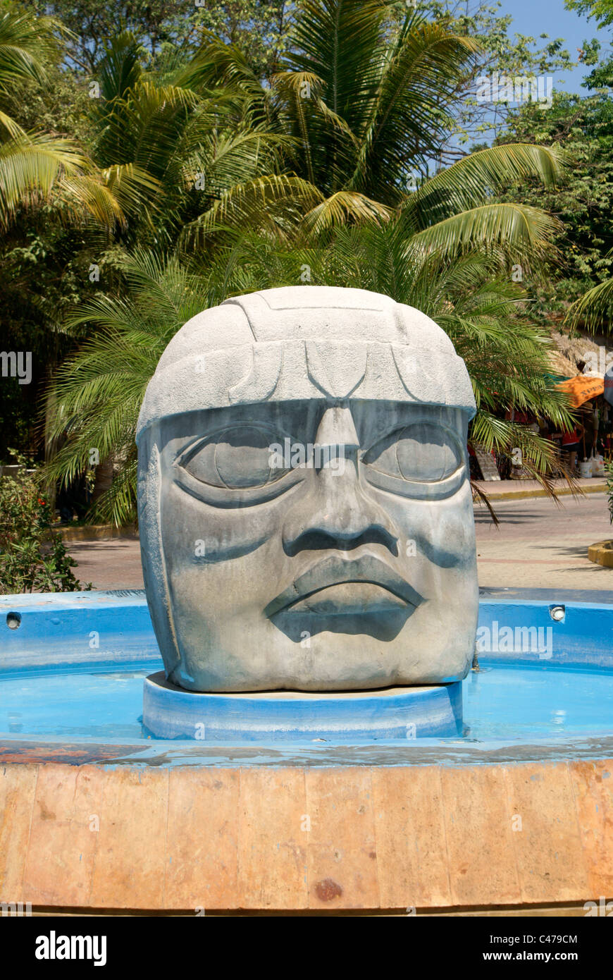 Olmec stone head and fountain in Playa del Carmen, Riviera Maya, Quintana Roo, Mexico Stock Photo