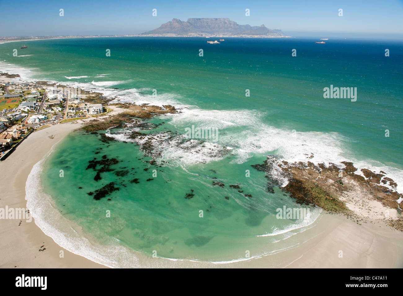 Aerial view of Big Bay on the west coast north of Cape Town in South Africa. Table Mountain is visible in the background. Stock Photo