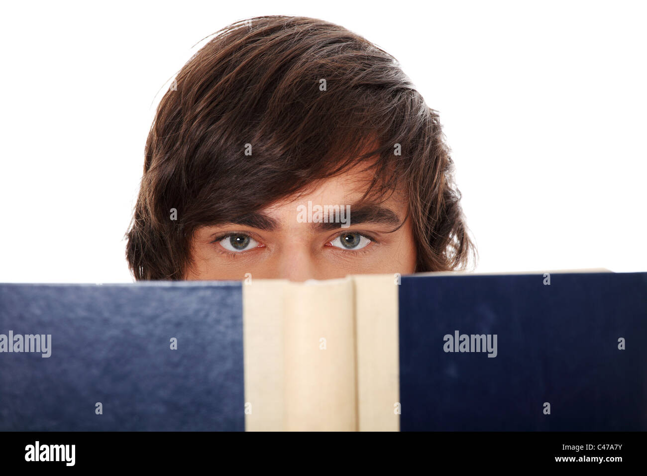 Teen man reading book , isolated on white background Stock Photo - Alamy