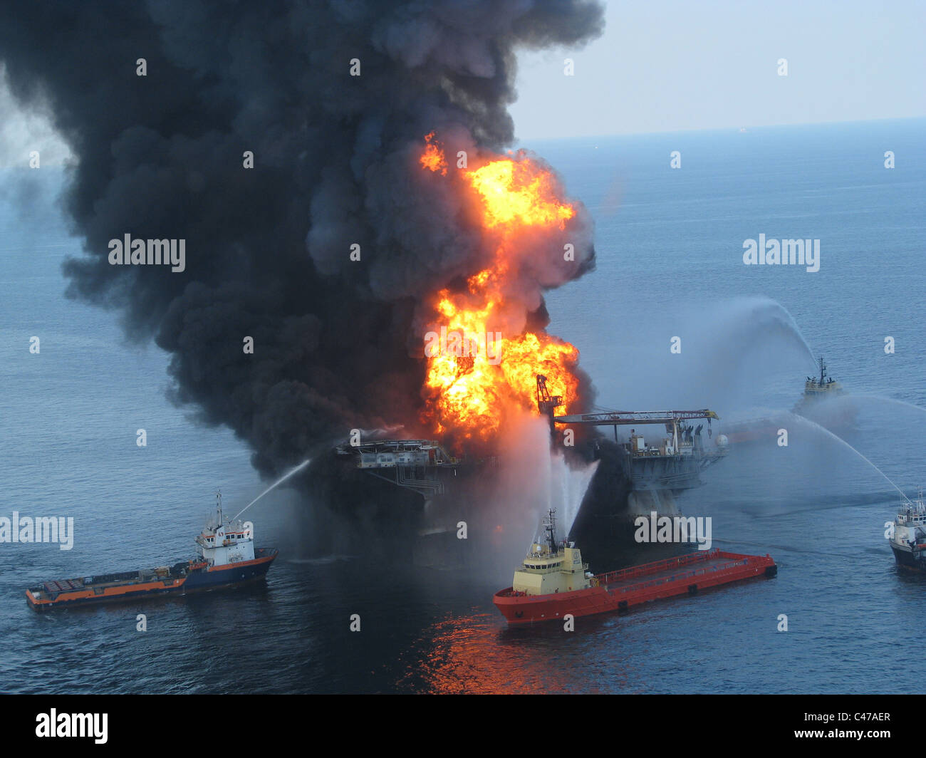 Fire boats battle an explosion at the off shore oil rig Deepwater Horizon Stock Photo