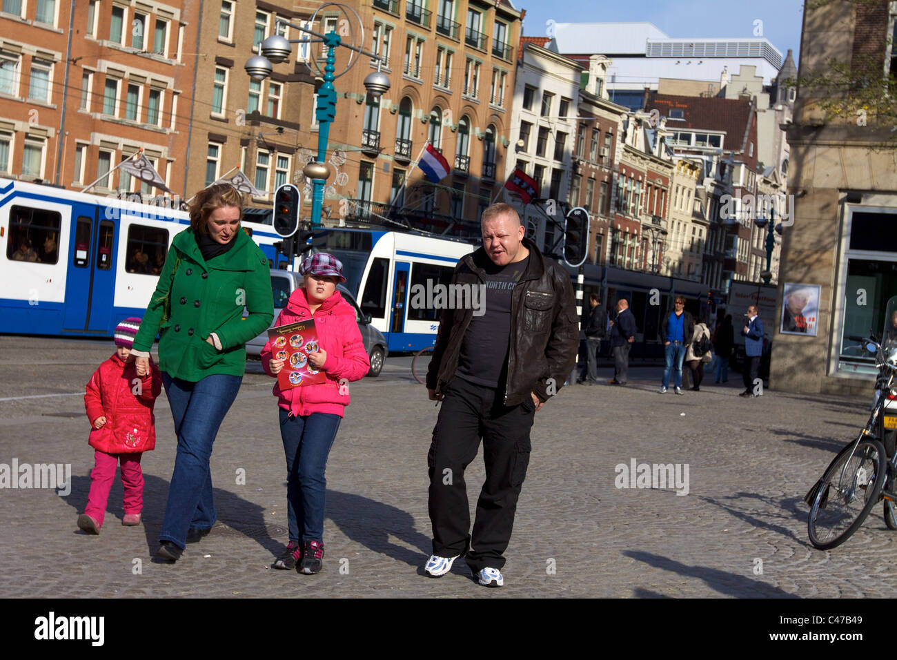 Tourists at Dam Square in Amsterdam, Holland, the Netherlands Stock Photo