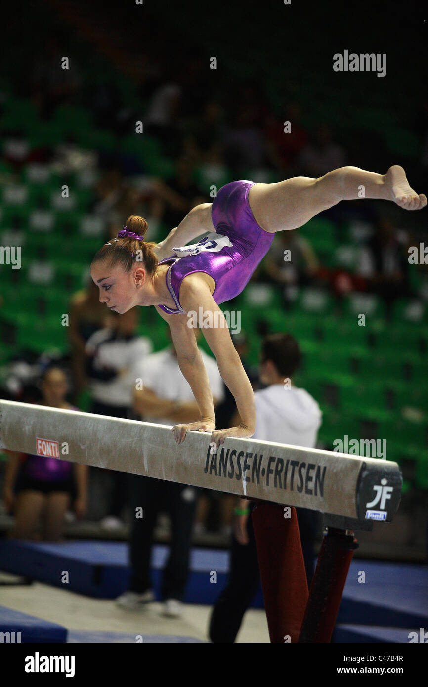 gymnastics competition a gymnast performing her balance beam routine