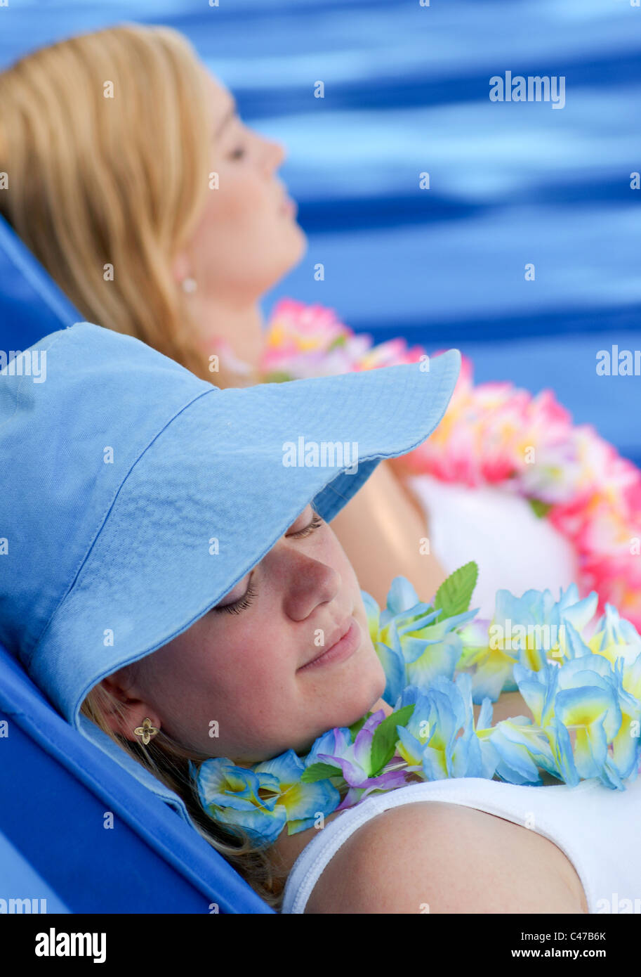 Tow beautiful young women on vacation resting and relaxing Stock Photo