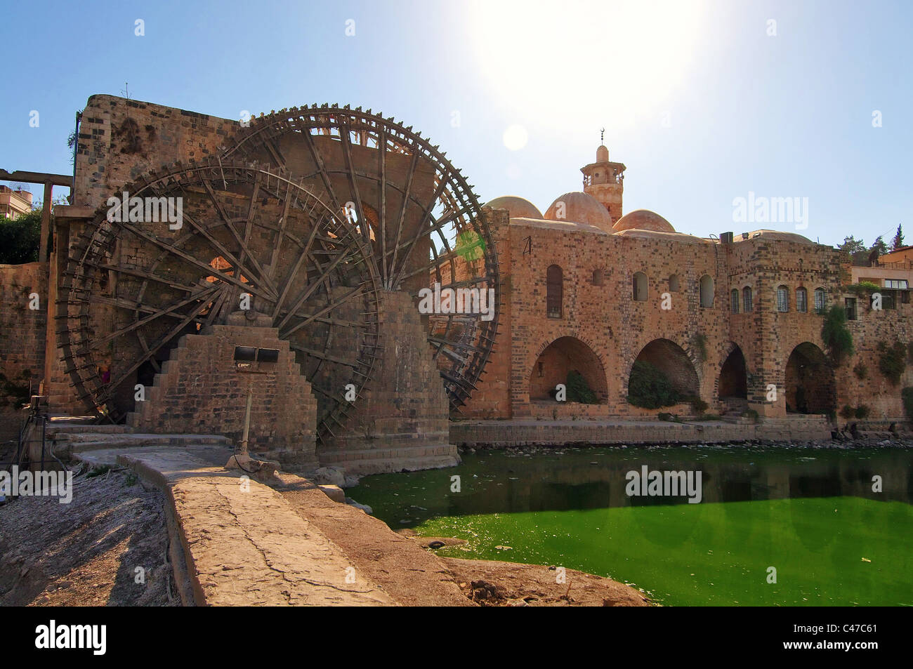 Noria (machine for lifting water) of Hama on the Orontes River Stock Photo