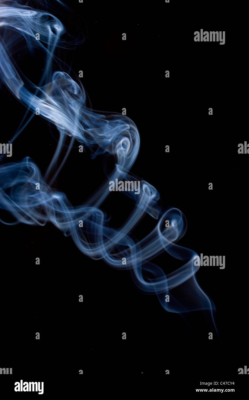 Wisp Smoke Rising Dark blue wisps smoke swirling hi-res stock photography and images - Alamy