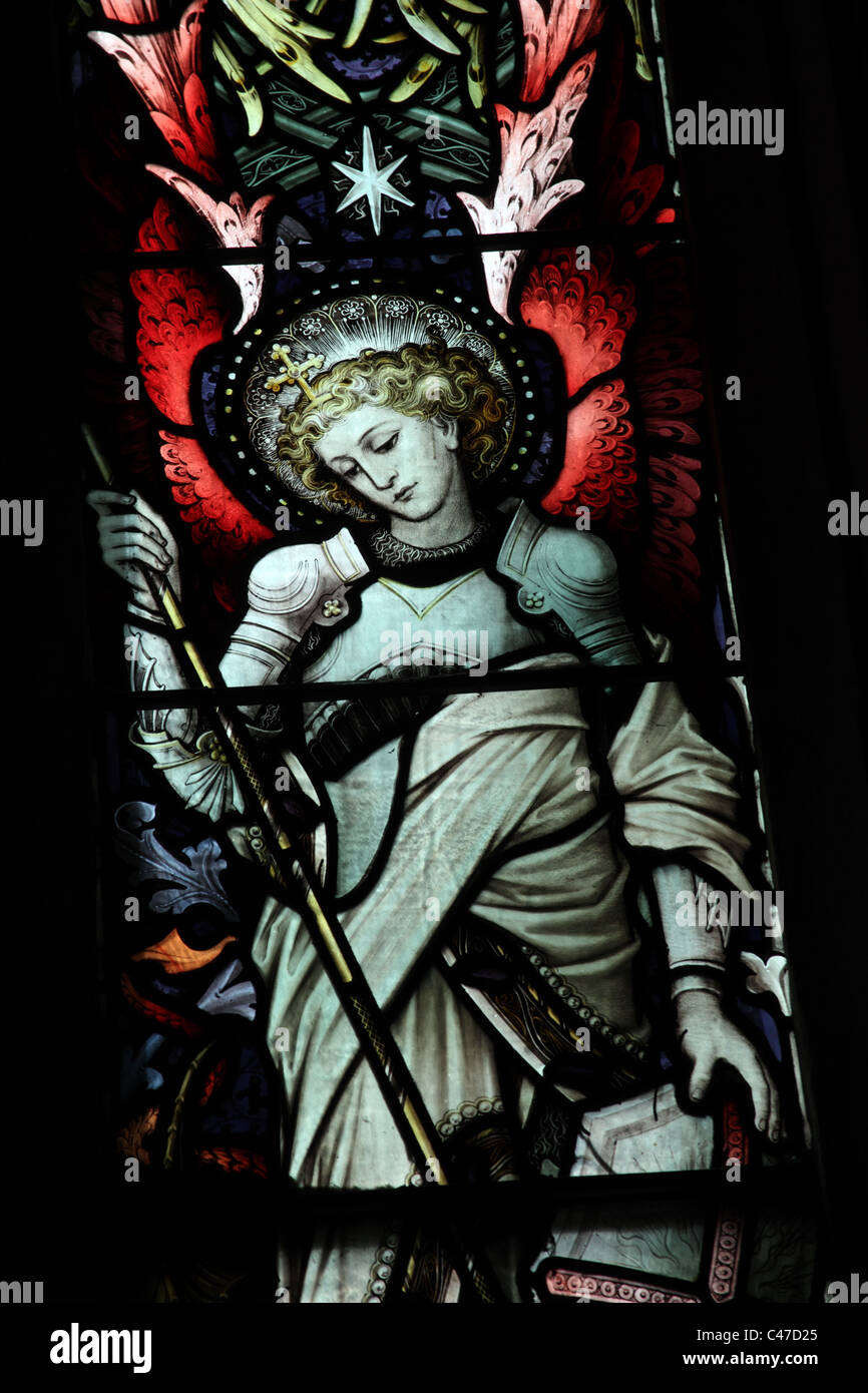 A stained glass window by John Hardman & Co. depicting The Archangel Michael, St Nicholas's Church, Tackley, Oxfordshire Stock Photo
