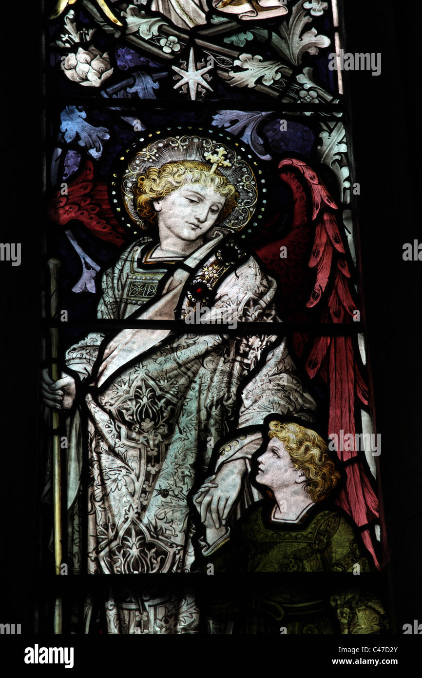A stained glass window by John Hardman & Co. depicting The Archangel Raphael, St Nicholas's Church, Tackley, Oxfordshire Stock Photo